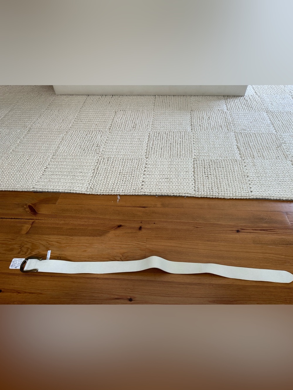 Free people white leather belt with brass hardware.